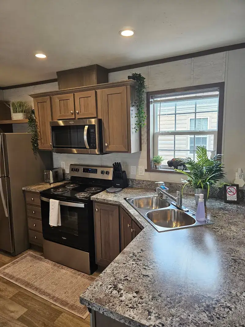 Cozy 3BR Lodge: Kitchen with stove and microwave