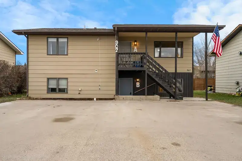 Entire duplex: Duplex exterior from the driveway