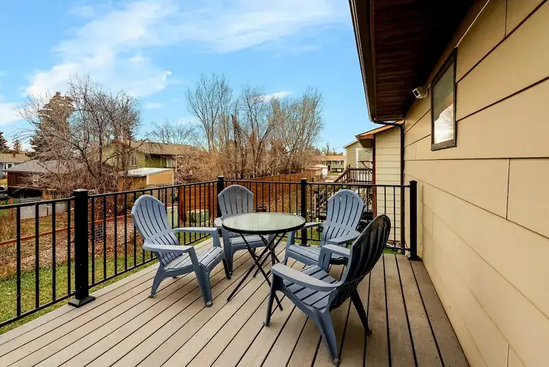 Entire duplex: Deck with patio chairs and table