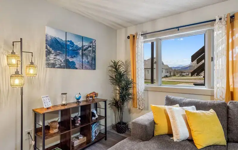 Entire duplex: Living room with sofa by window