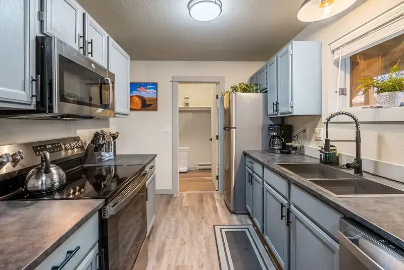Entire duplex: Kitchen with stove and sink