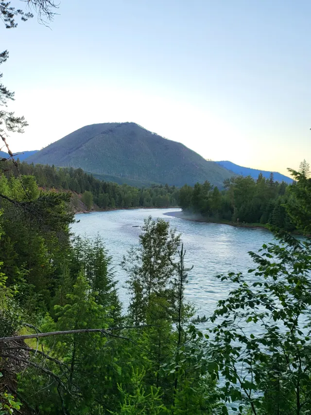 River at sunset with a mountain behind, Glacier